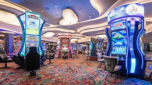 Tampilan studio live dealer Asia Gaming dengan dealer profesional dan antarmuka meja